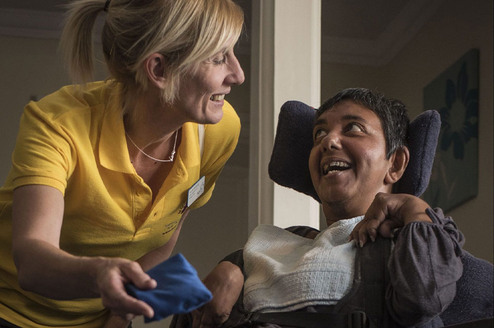 a carer looking after somone with a physical disability